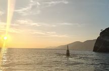 Aperitif on a boat at sunset, Porto Venere and islands