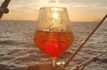 Aperitif on a boat at sunset, Porto Venere and islands
