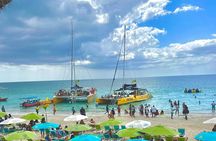 7 Mile Beach Party Catamaran Cruise with Snorkeling & Ricks Cafe 