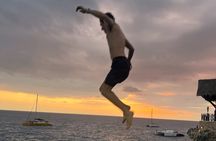 7 Mile Beach Party Catamaran Cruise with Snorkeling & Ricks Cafe 