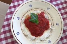 Hands in dough between orecchiette and focaccia in nature