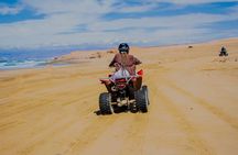 Quad Bike and Sandboarding on Sand Dunes Wild Beach