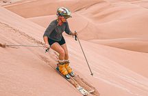 Sandboarding or Sandsky with sunset in Huacachina