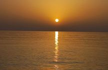 Golden Hour Escape on Relaxing Sunset Boat Tour with Local Wine