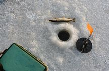 Ice Fishing Adventure in Lapland's Arctic Wilderness in Levi