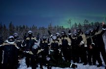 Arctic Aurora Chase by Snowmobile