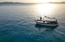 Boat Sunset Aperitif Tour in Tavolara and Molara
