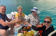 Tour of the Gulf of Cagliari with snorkeling stops and aperitif.
