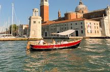 Sunset in a typical boat in Venice