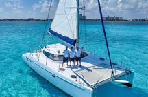 Afternoon Catamaran to Isla Mujeres: Snorkel, Open Bar & Sunset
