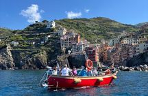 Boat ride from Riomaggiore with stop for swimming and local wine.