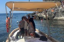 Boat ride from Riomaggiore with stop for swimming and local wine.