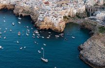Group boat ride in Polignano between caves, swimming and aperitif