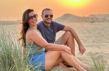 Abu Dhabi Evening Desert Safari: BBQ Dinner, Camel Ride & Shows