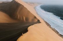 Shared Tour Qatar Desert Adventure with Sandboarding Camel Ride