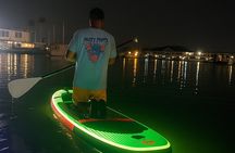 Nighttime iSUP Glow Paddleboard Adventure in Daytona Beach