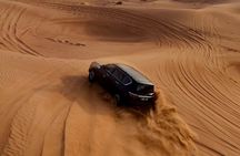 Premium Desert Safari Camel Ride with Sandboarding and BBQ Dinner