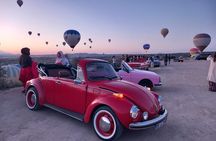 Romance on Wheels: Vintage Car Sunrise Ride with Balloon Views