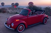 Romance on Wheels: Vintage Car Sunrise Ride with Balloon Views