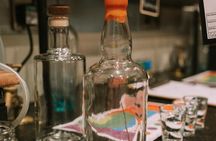 Distill a bottle of Gin on mini copper stills