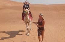 Morning Desert Safari: Dune Bashing, Sand boarding & Camel Ride