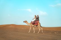 VIP Dubai Desert Safari with Quad Bike, Camel Ride, Dinner, Shows
