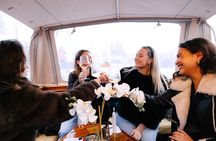 Explore Amsterdam's Canals Aboard a Cozy Small Group Cruise