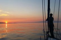Aperitif on a sailing boat at sunset in Catania