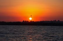 Aperitif on a sailing boat at sunset in Catania