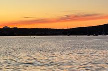 Sunset with dolphins and aperitif on a sailboat in Golfo Aranci