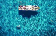 Ibiza Beach Hopper with Lunch Open Bar Paddle Surf and Snorkeling