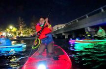 Nighttime iSUP Glow Paddleboard Adventure in Daytona Beach