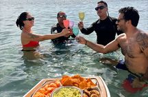 Aperitif cruise at sunset in the Tahiti lagoon