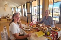 Overnight stay in luxury desert camp camel ride &sandboarding
