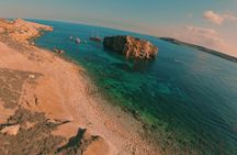 Sunset Comino Lagoons and Sea Caves Tour