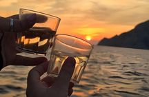 Cinque Terre sunset boat tour with a traditional ligurian gozzo