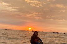 Paddle surfing experience at sunset