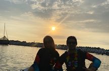 Paddle surfing experience at sunset