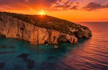 Zakynthos Sunset Boat Tour to Blue Caves, Swim Stops and Aperitif