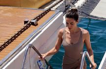 Full Day Catamaran Cruise with BBQ and Open Bar on Costa Dorada