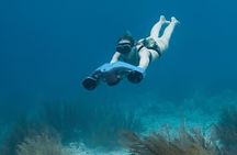 Snorkeling with sea scooters and scenic boat ride