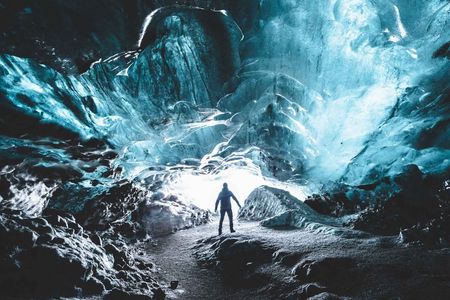 Explore a blue ice cave
