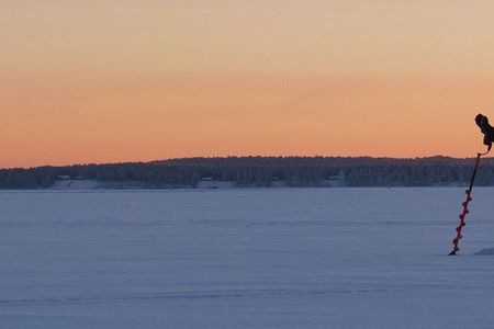 Guided ice fishing experience in Luleå