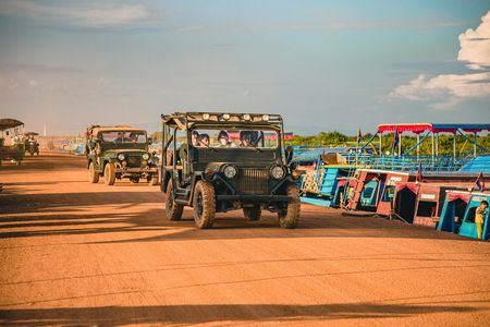 Exploration of floating village by 4x4 and sunset boat tour