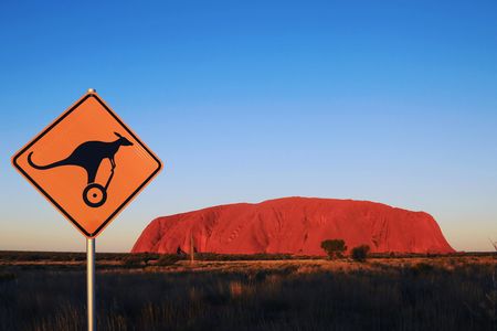 Quarter Uluru self-balancing scooter and sunset