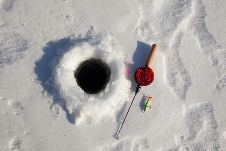 Ice fishing on lake Sirkkajärvi from Levi