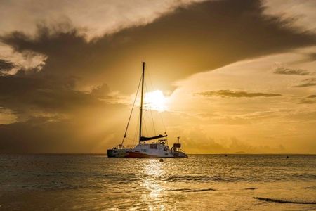 Irie catamaran sailing experience at sunset