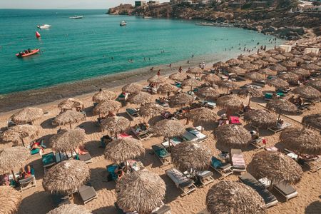 Middle rows seaside sunbed rental in Super Paradise Beach Mykonos
