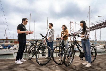 Lisbon bike tour, Tagus cruise and helicopter flight