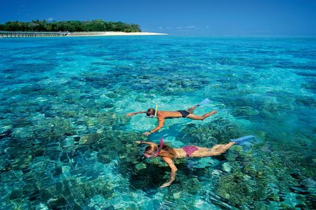Green Island full-day tour with snorkel gear or glass bottom boat